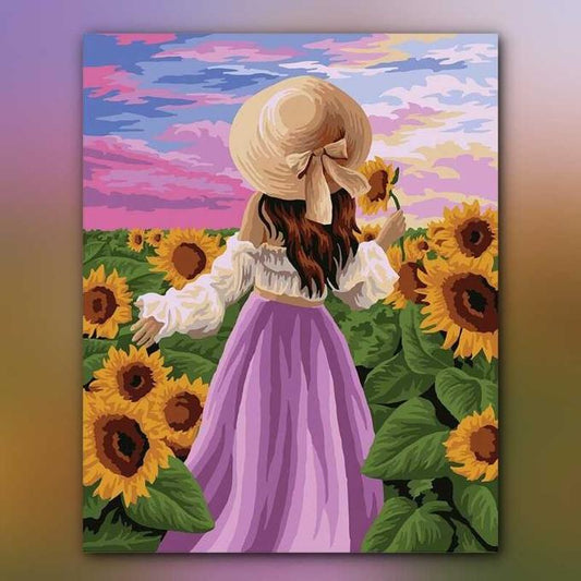 أدوات رسم لوحة بين زهور الشمس